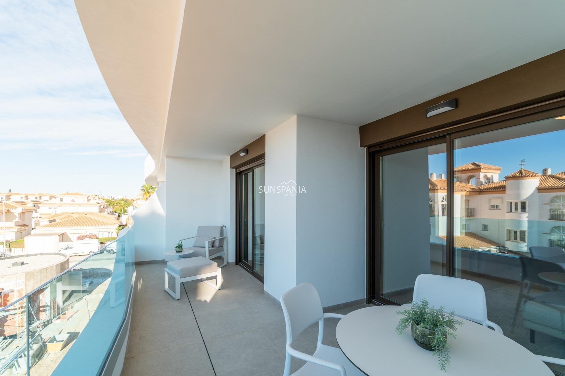 Obra nueva - Piso -
Orihuela Costa - Playa Flamenca