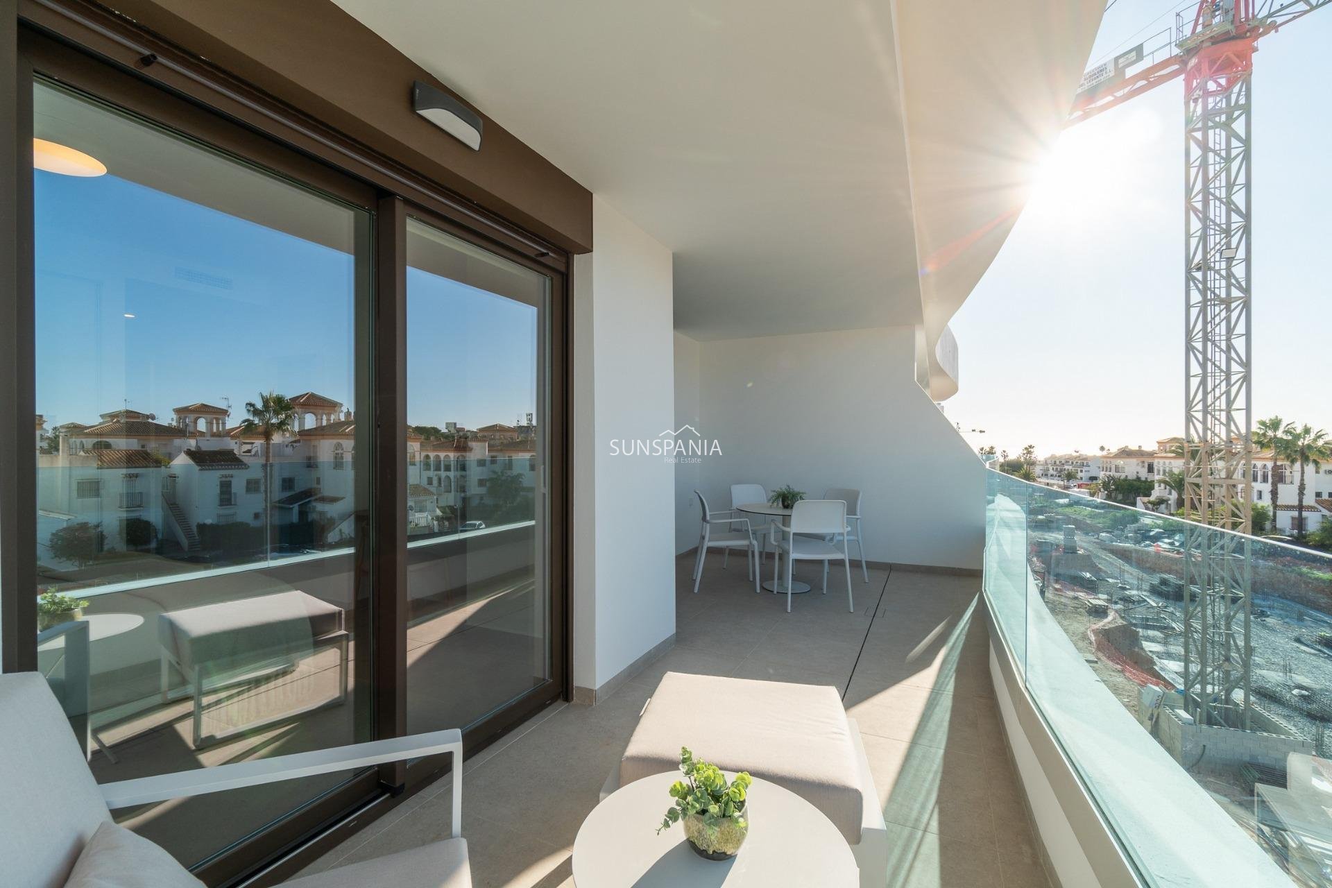 Obra nueva - Piso -
Orihuela Costa - Playa Flamenca