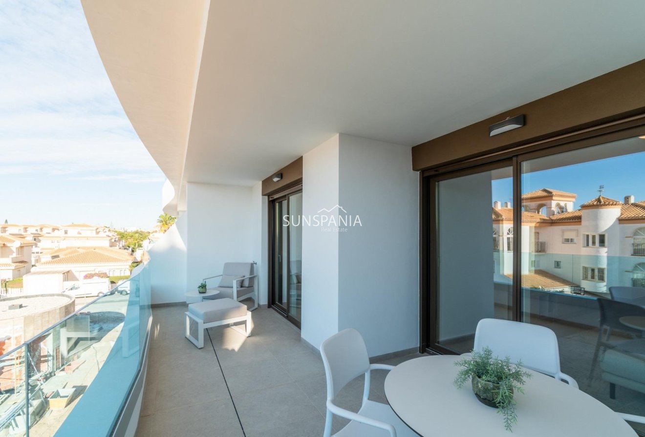Obra nueva - Piso -
Orihuela Costa - Playa Flamenca