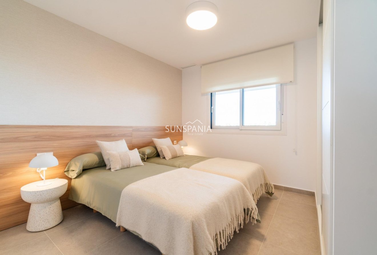 Obra nueva - Piso -
Orihuela Costa - Playa Flamenca