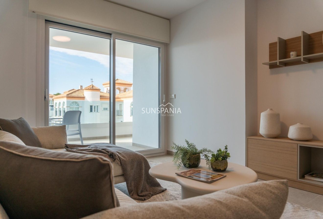 Obra nueva - Piso -
Orihuela Costa - Playa Flamenca